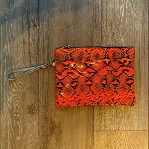 Orange snakeskin handbag